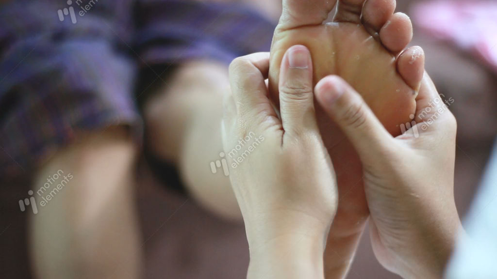 Hands Of Young Woman Gently Touch Massage To Foot Of Old Stock Video Footage Hands Of Young Woman Gently Touch Massage To Foot Of Old Stock Video Footage