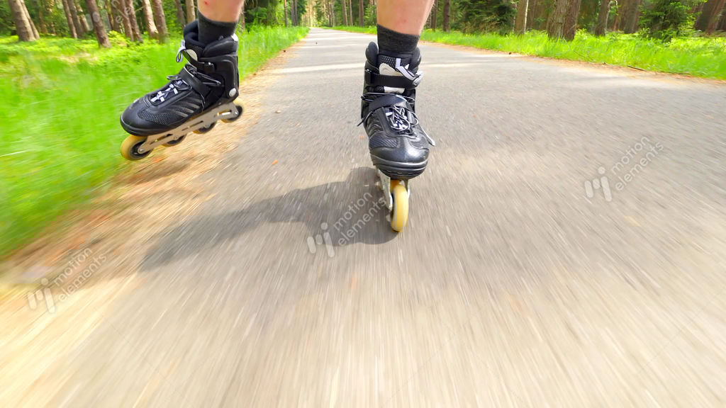 Outdoor Shuffle Inline Skating. Mans Legs Roller Skating On Forest