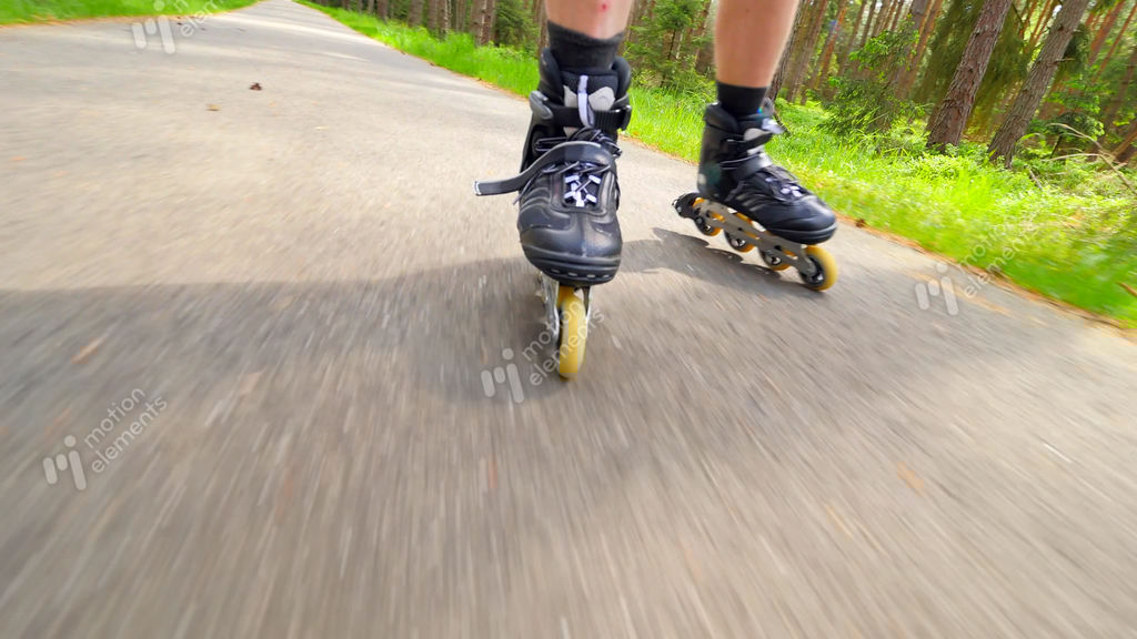 Outdoor Shuffle Inline Skating. Mans Legs Roller Skating On Forest