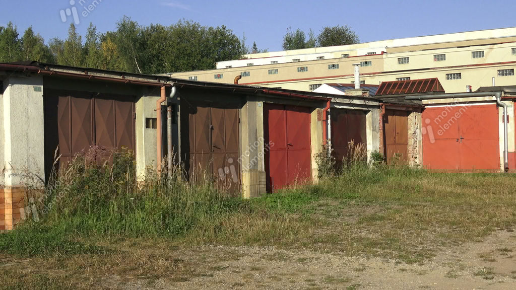 Old Worn Abandoned Garages.Old Metal Garage Doors.The Aged Gates Of Old