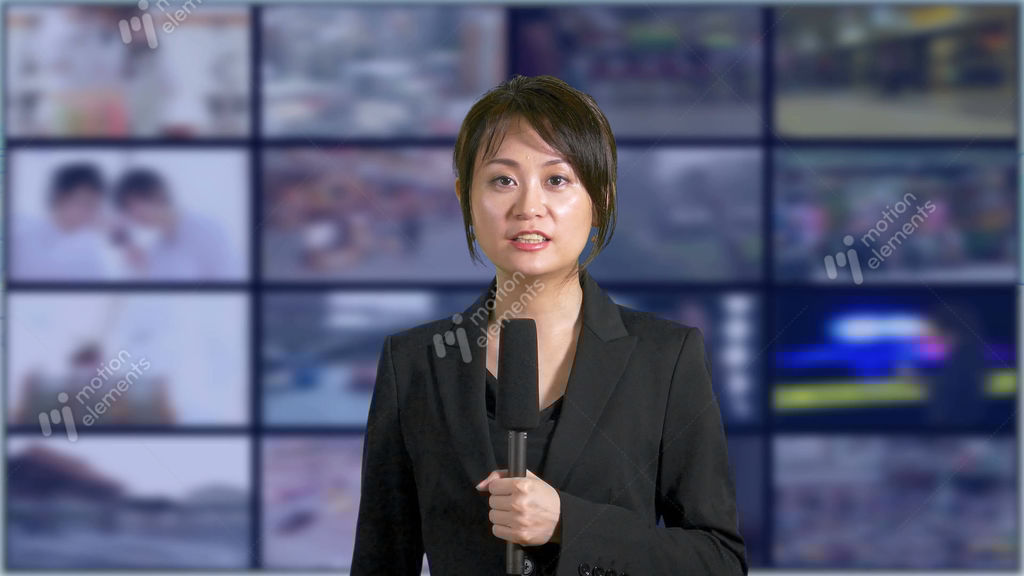 Asian Chinese News Presenter With Grid Of TVs Stock video footage
