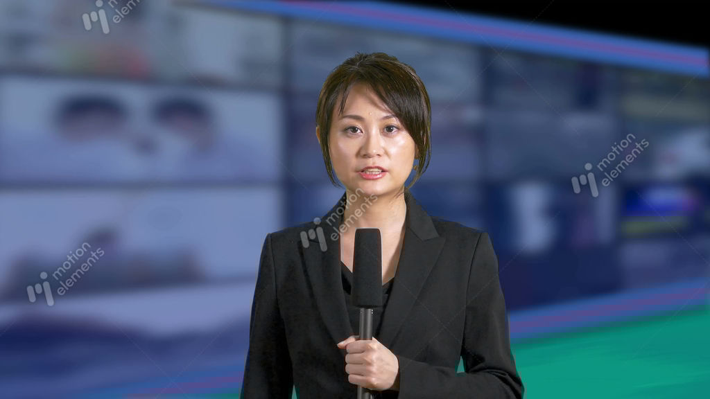 Serious Asian Chinese News Presenter With Grid Of TVs Stock video