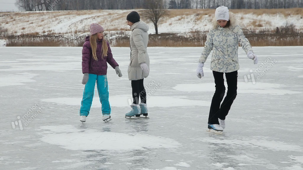 Family Ice Skating On Frozen Lake Stock video footage 9080186