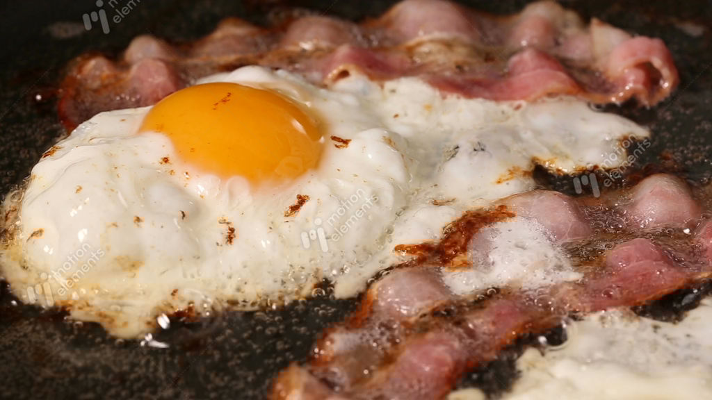 Frying Pan With Bacon And Eggs Stock video footage 11037398