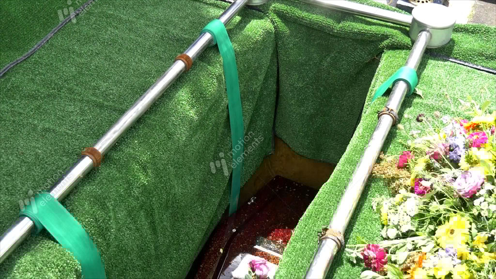 Casket Being Lower Into Burial Site At Cemetery Stock video footage