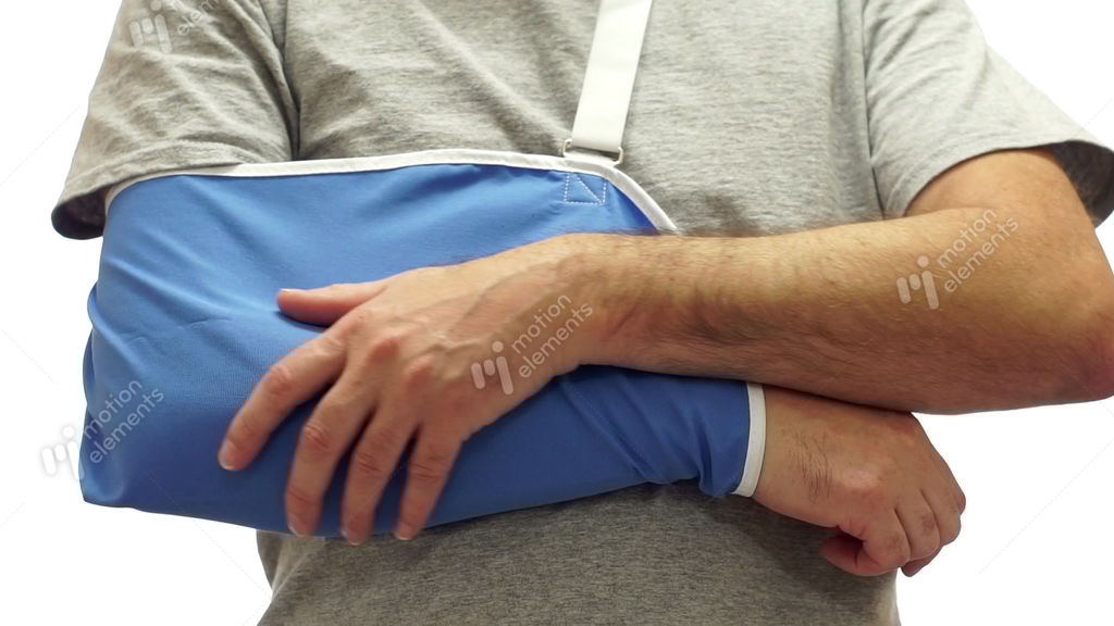 Man Rubs Sore Arm In Medical Sling Stock video footage 9376911