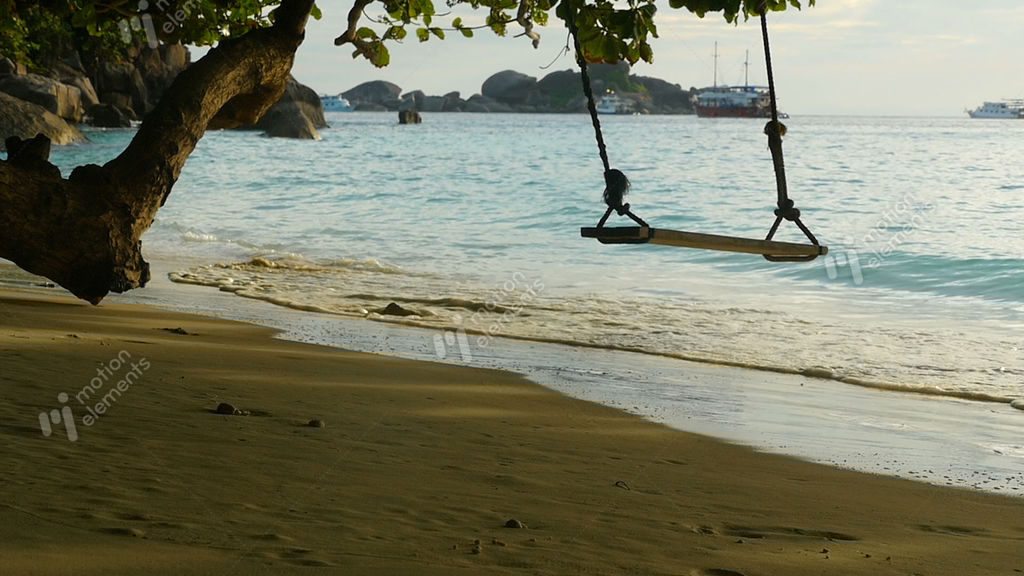 A Rope Swings On The Beach Stock video footage 9385462