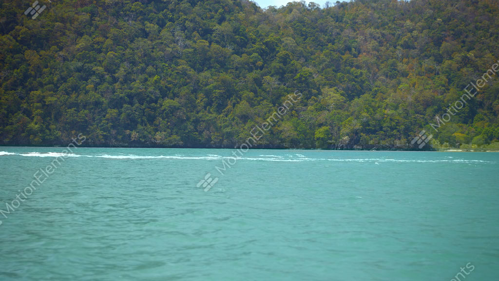 Fishing Boat Passing A Forested Tropical Island In Timelapse Stock Video Footage Fishing Boat Passing A Forested Tropical Island In Timelapse Stock Video Footage